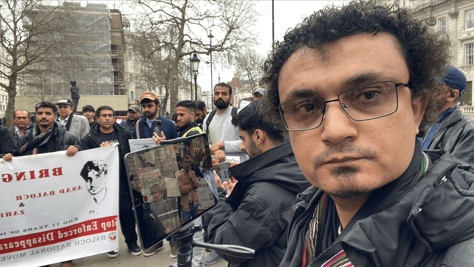 Aomar Karim, Baloch human rights activist, attending the BNM protest at 10 Downing Street on 23 March 2025, demanding justice for Balochistan's enforced disappearances.