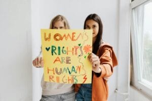 women holding a poster