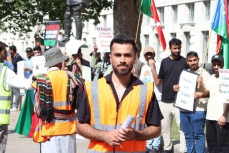 Shabar Jamaldini, Baloch political activist, with supporters advocating against his deportation in the UK