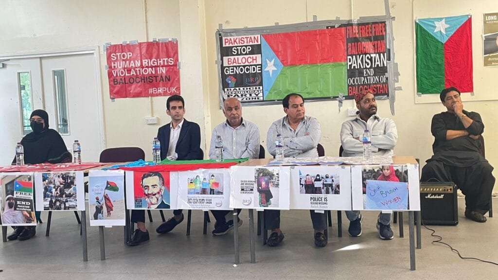 All speakers on stage at the London remembrance event for Nawab Akbar Khan Bugti, including Baloch and Sindhi political and human rights leaders.