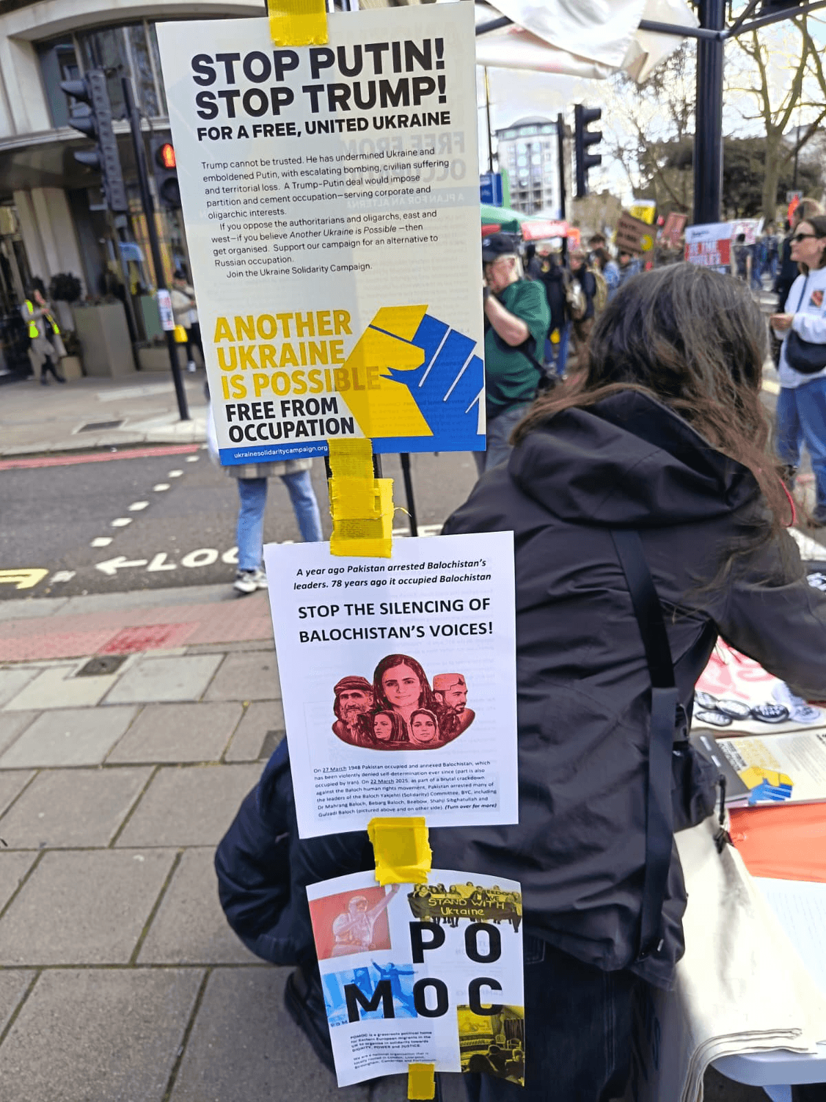 Disappeared, Killed, Silenced: Pakistan's Brutal Crackdown on Balochistan Exposed 5 28 March 2026 London Protest: Protest stall displaying Balochistan and Ukraine solidarity leaflets on a pole in London